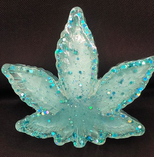 Clear with teal glitter and a teal bottom