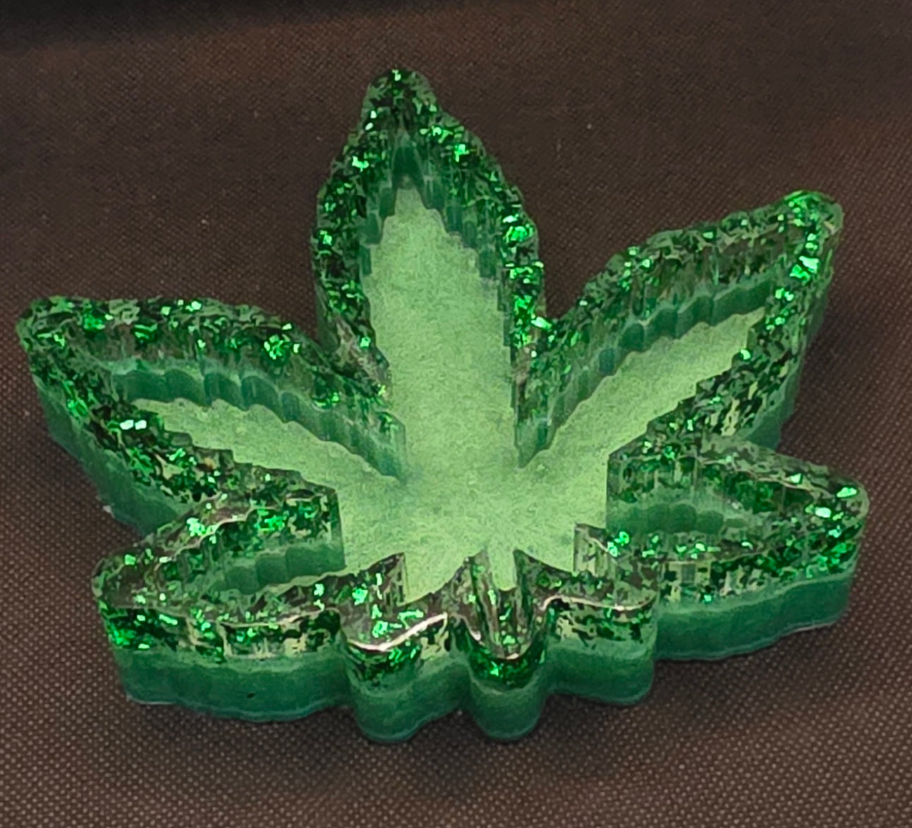 Clear with dark green foil, light green bottom